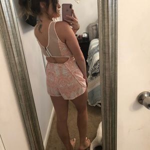 Pink and white romper with cutout